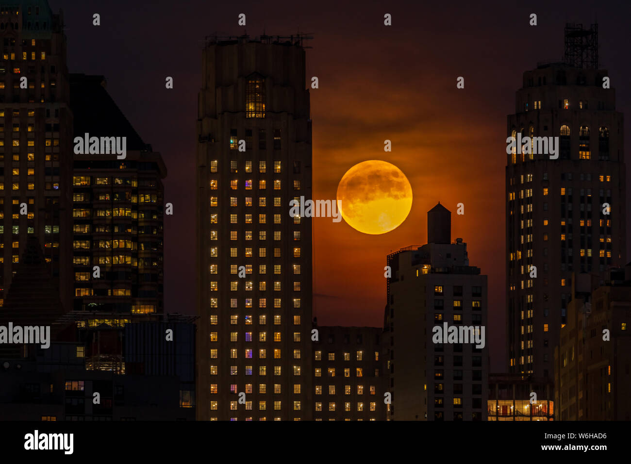 Full Moon Over Manhattan Skyline at night Stock Photo - Alamy
