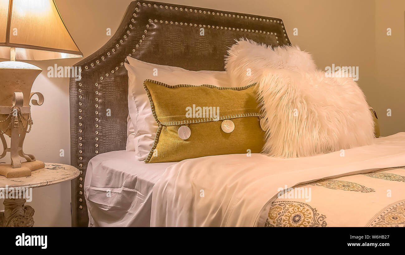 Panorama Double Bed With Fluffy Pillows Against The Upholstered