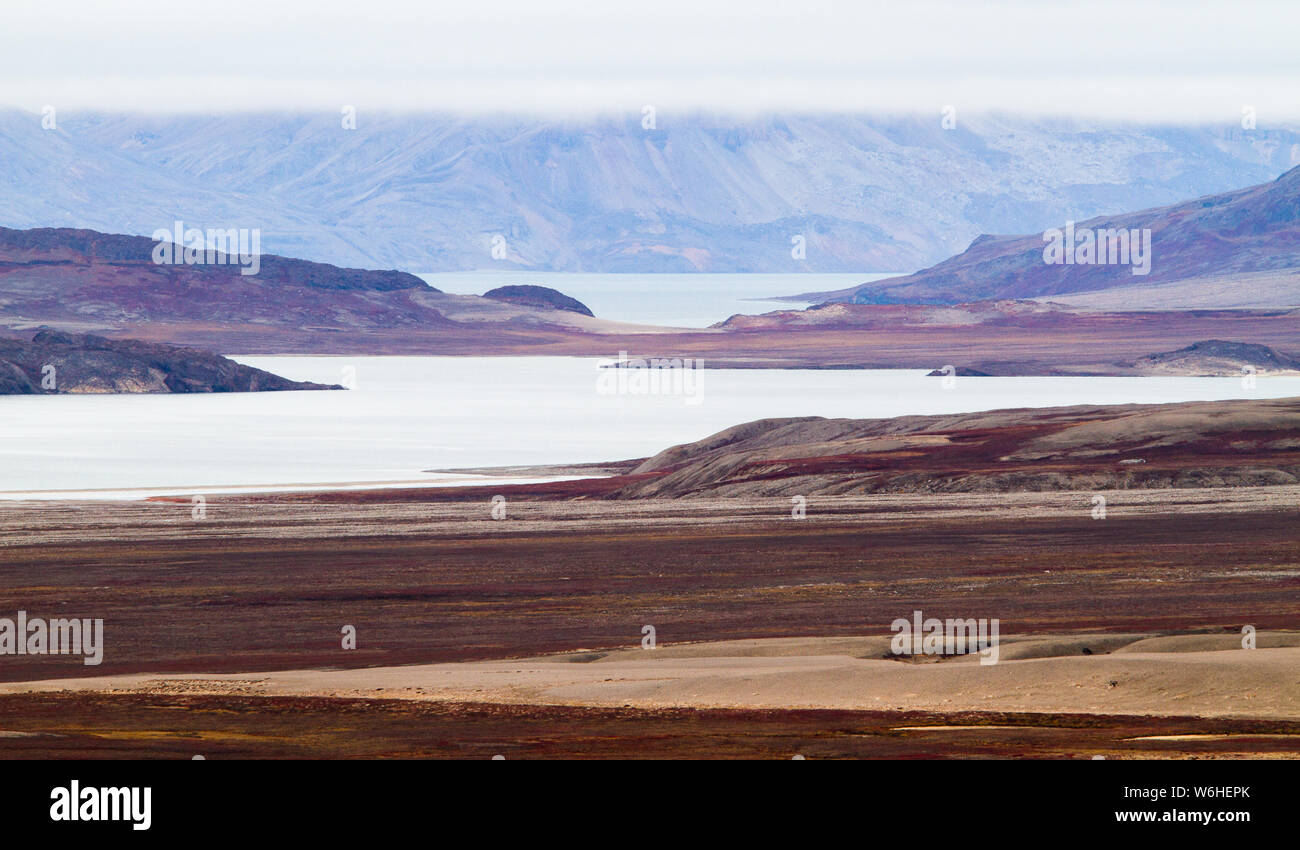 Land masses sprawl across the landscape lazily, in Holmbugt, Greenland Stock Photo
