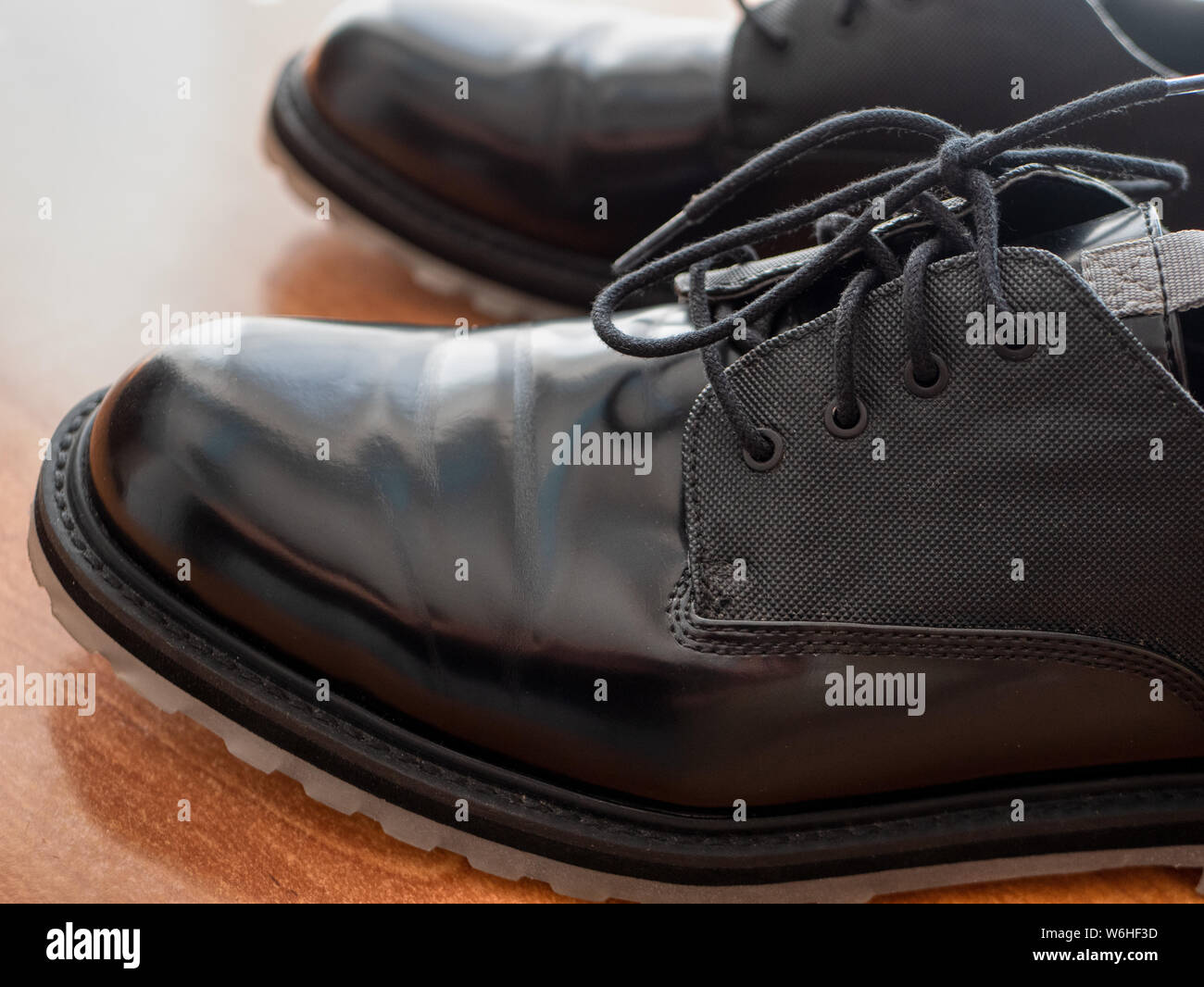 Black leather shoe laces in close-up Stock Photo - Alamy