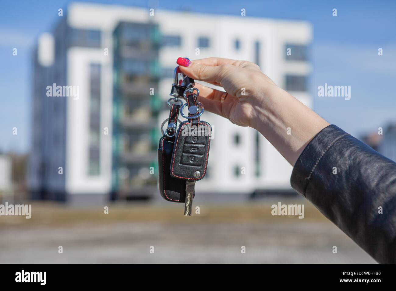 Car keys in a girl's hand on a blurred background of a new house Stock ...