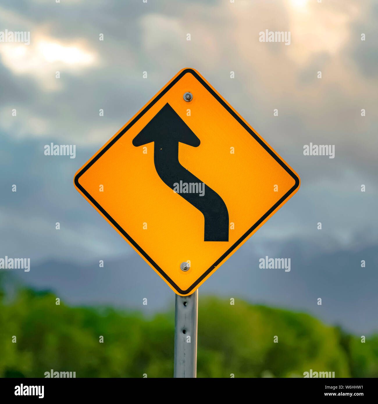 Square Close up view of a Winding Road Ahead sign and No Motorized ...