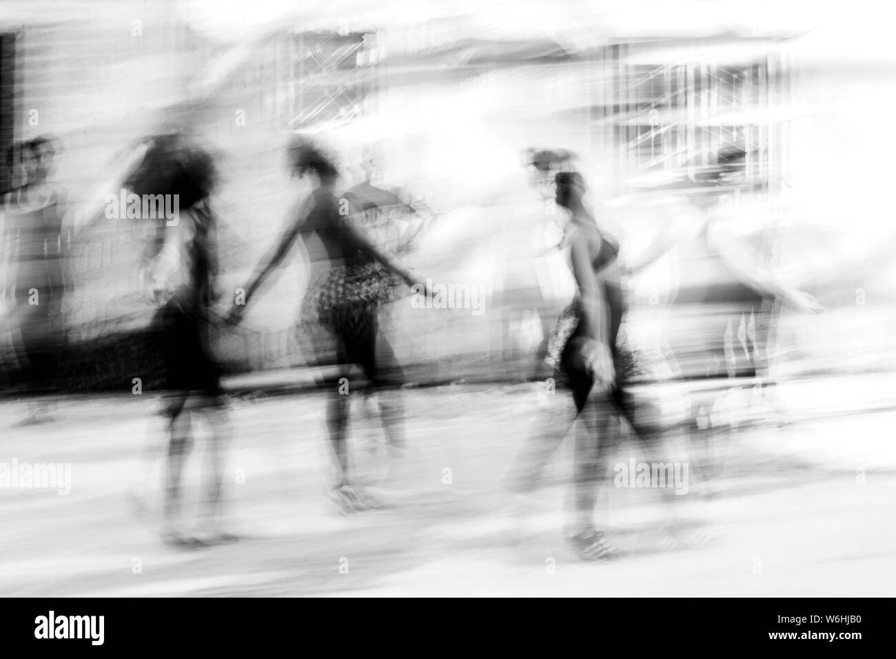 Black and white image of Cuban dance with dancers blurred in motion; Havana, Cuba Stock Photo
