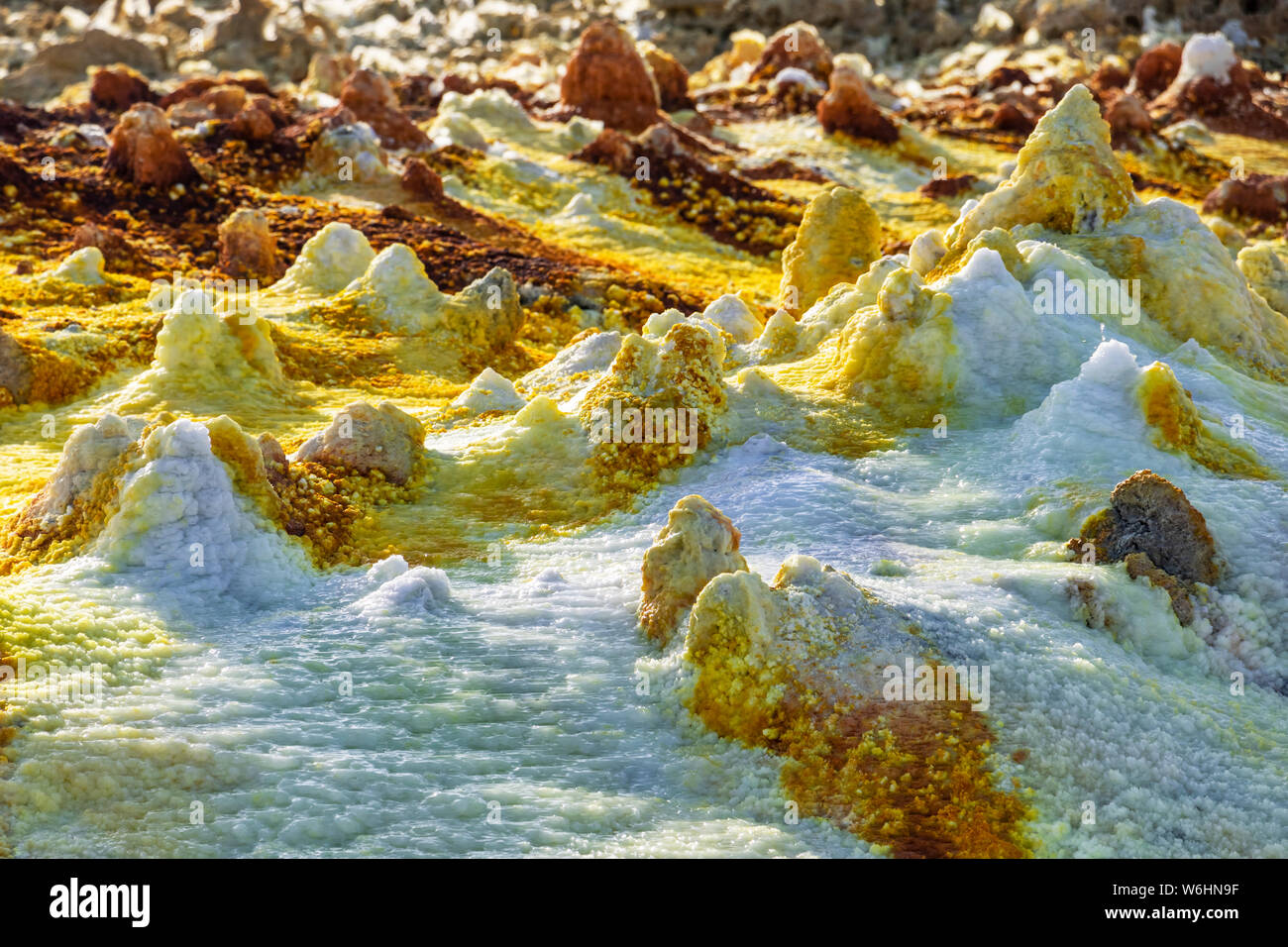 Acidic hot springs and geysers, mineral formations, salt deposits in the crater of Dallol Volcano, Danakil Depression; Afar Region, Ethiopia Stock Photo