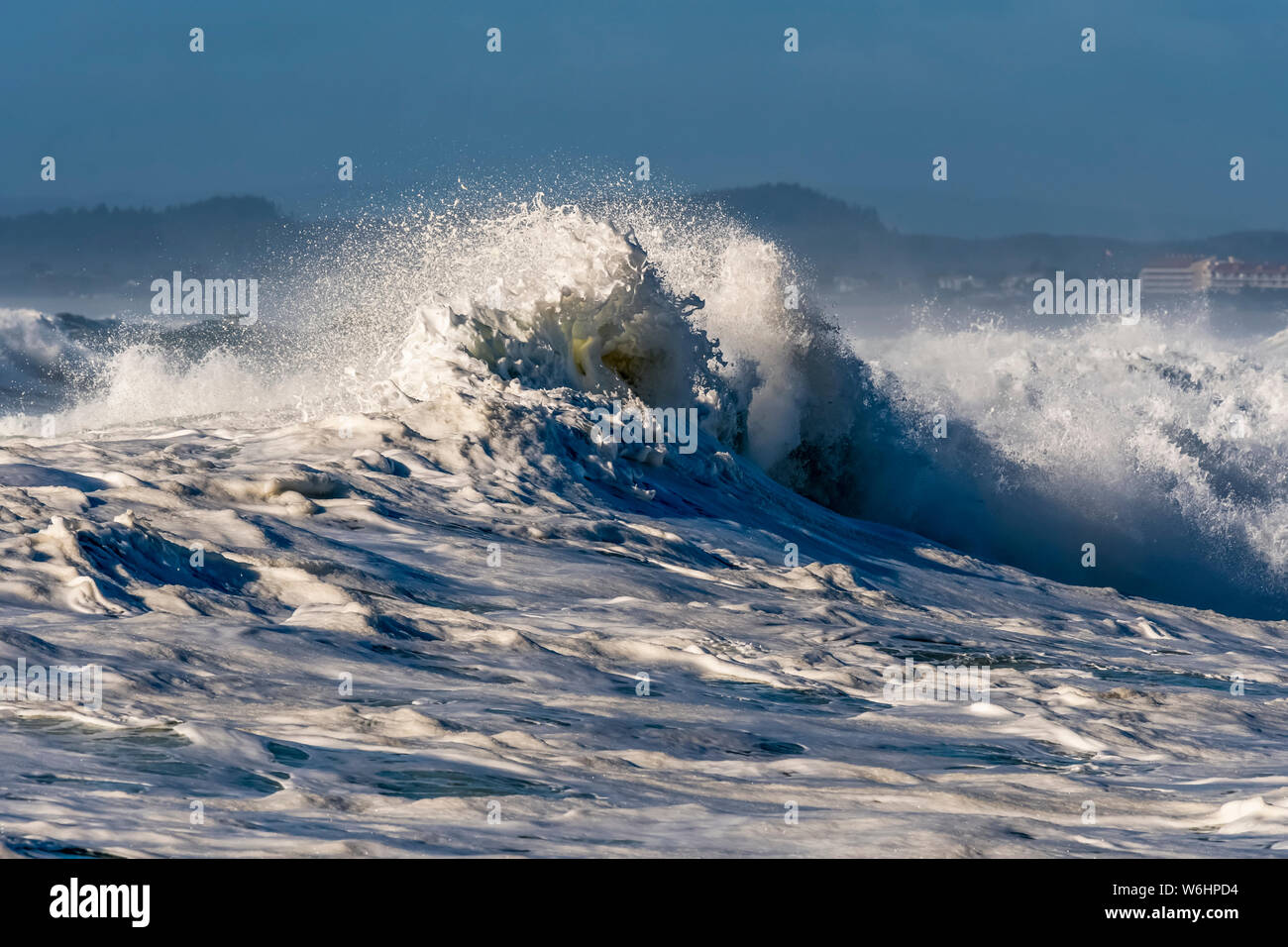A wave breaks at Seaside Cove; Seaside, Oregon, United States of America Stock Photo