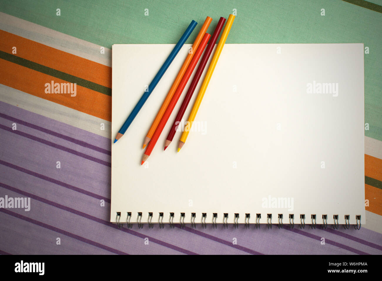 Spiral sketch pad and graphite pencils template image. Good copy space.  Back to school, homework, hand drawing artist concept Stock Photo - Alamy