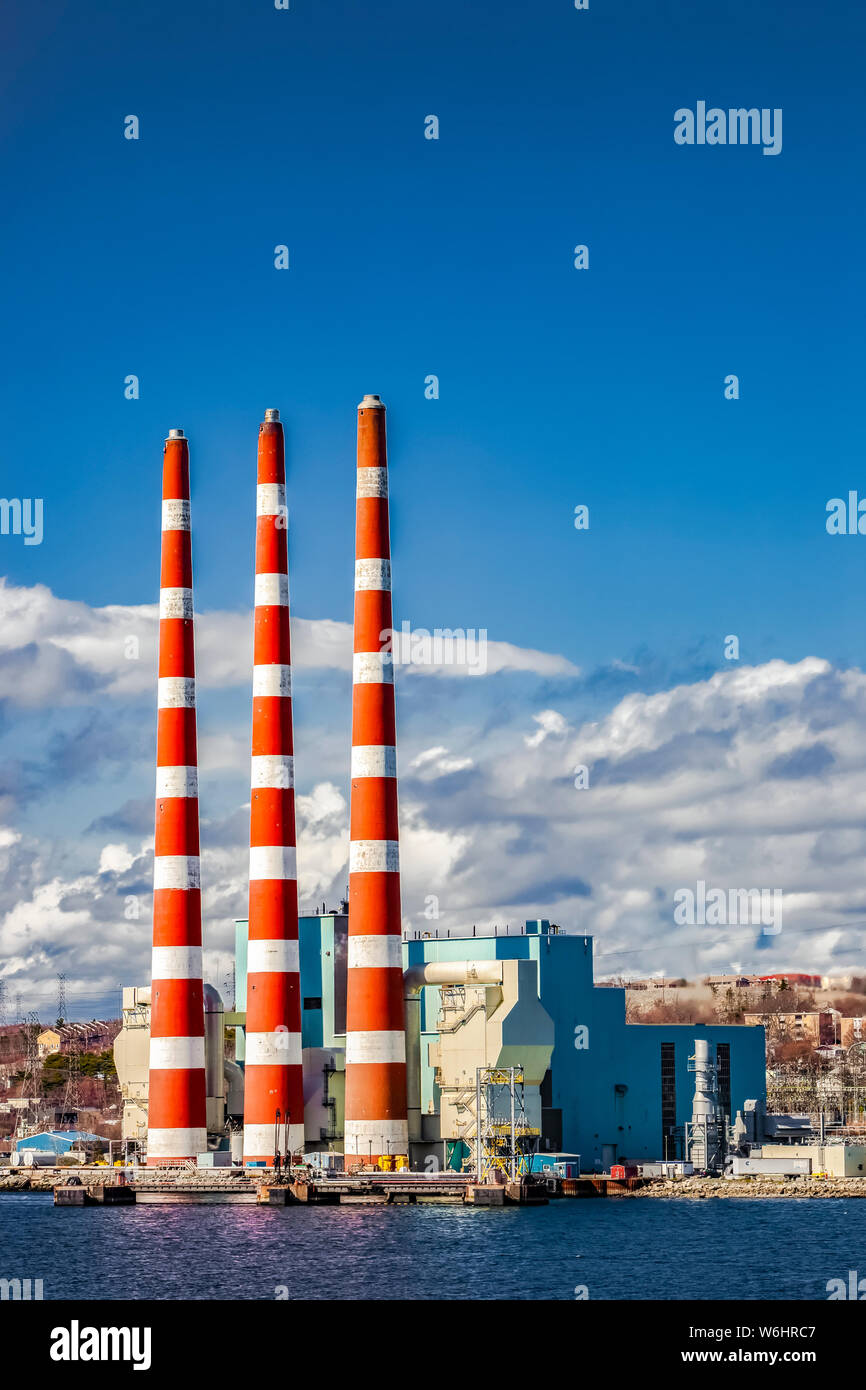 Tufts Cove Electrical Generating Station with smoke stacks in the Dartmouth harbour; Dartmouth, Halifax, Nova Scotia, Canada Stock Photo