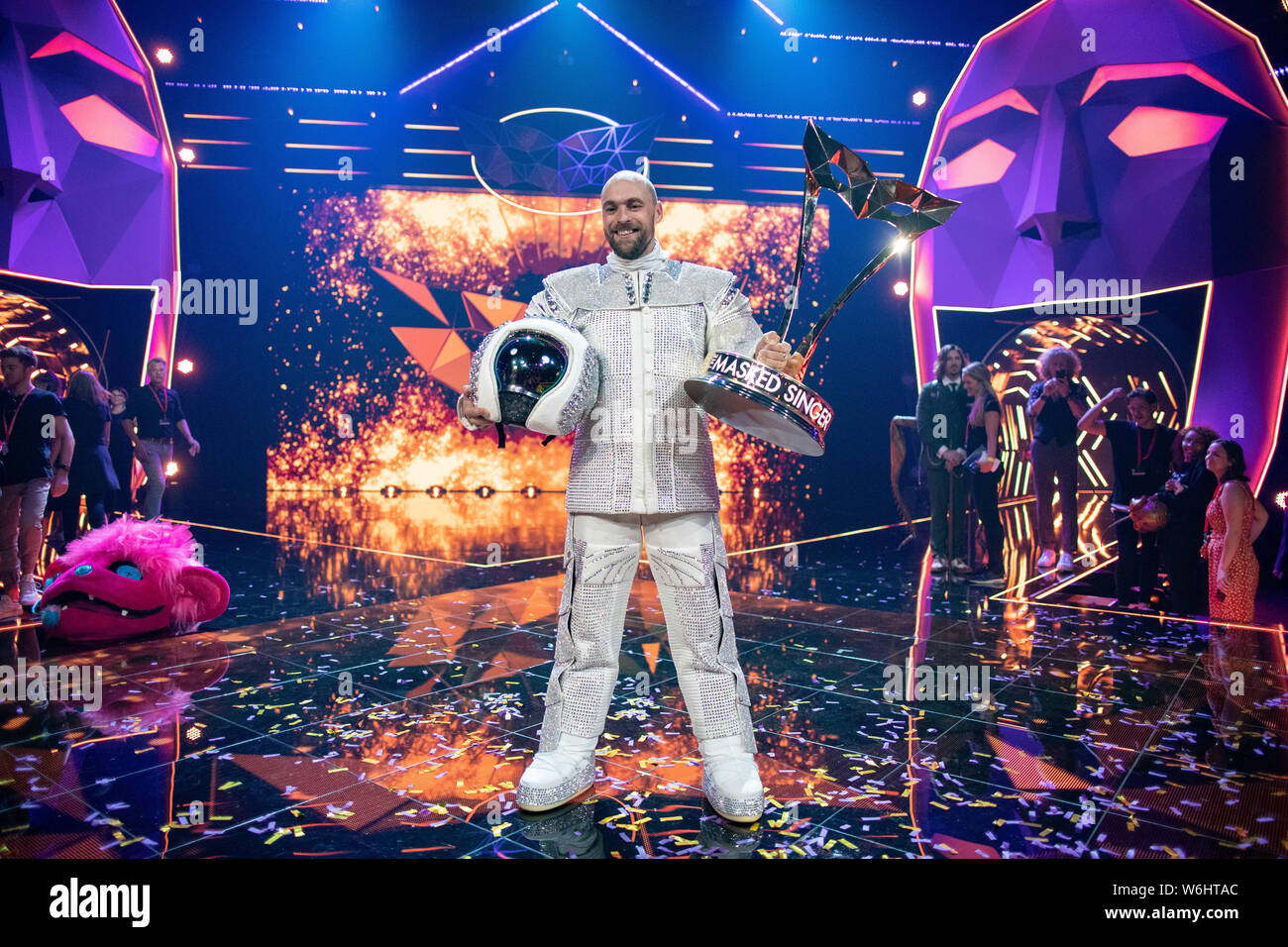 Cologne, Germany. 02nd Aug, 2019. The winner of the ProSieben show "The  Masked Singer", Max Mutzke, stands as "astronaut" after the show with his  trophy on stage. Credit: Marcel Kusch/dpa/Alamy Live News