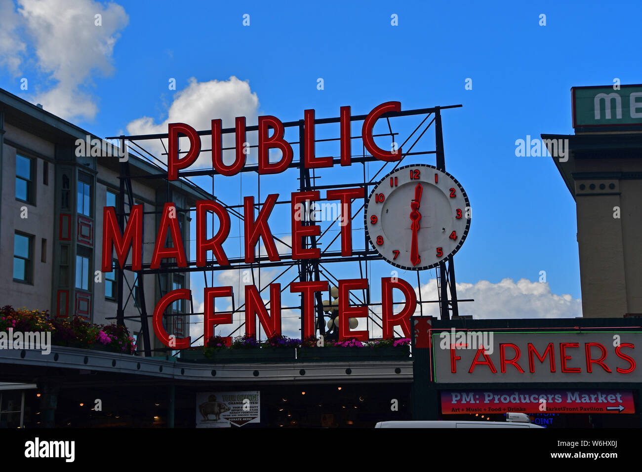 The iconic clock and sign for the Pike Place Market in downtown Seattle