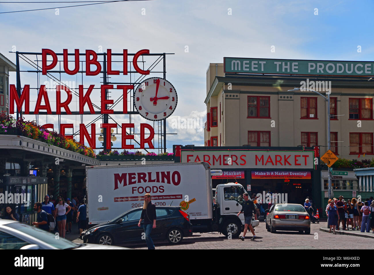 The iconic clock and sign for the Pike Place Market in downtown Seattle