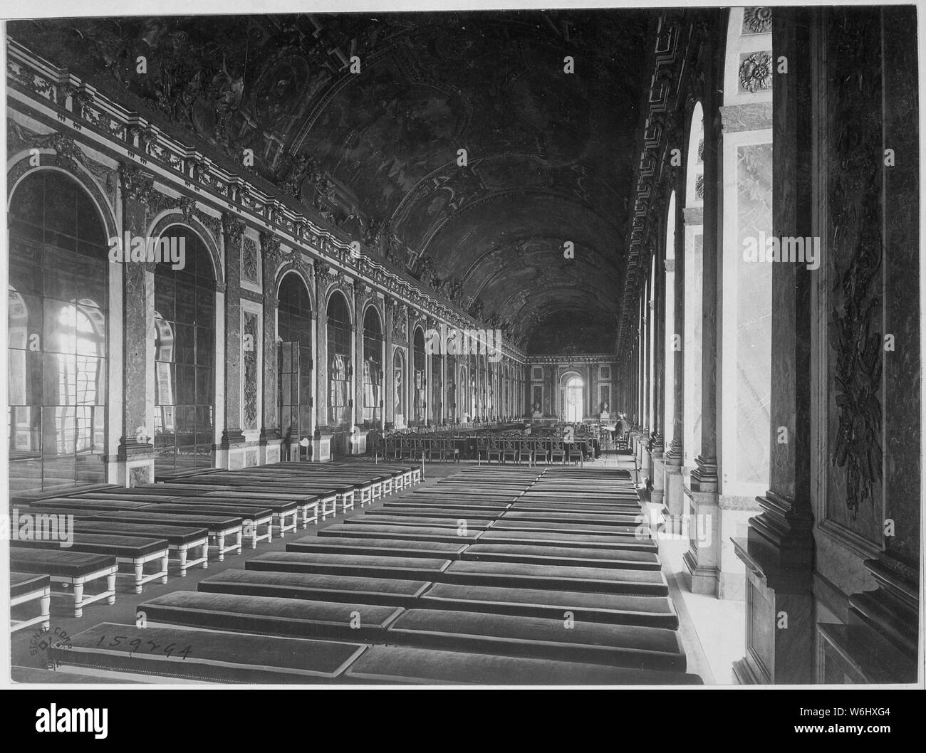 Interior of the Galerie des Glaces showing the arrangement of tables for the signing of Peace Terms, Versailles, France., 06/27/1919; General notes:  Use War and Conflict Number 723 when ordering a reproduction or requesting information about this image. Stock Photo