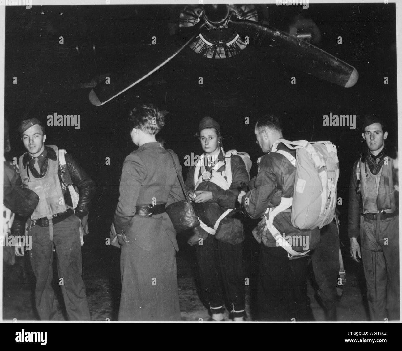 Jedburghs in front of B-24 just before night takeoff. Area T ...