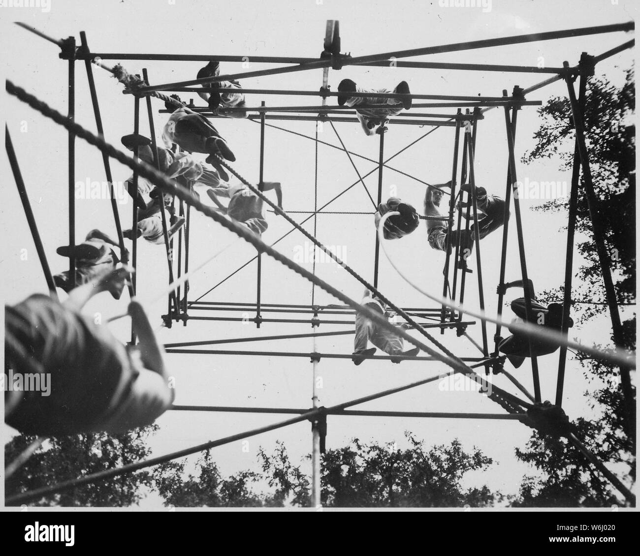 Jeds on high bars in obstacle course. Milton Hall, England, circa 1944., 1943 - 1944; General notes:  Use War and Conflict Number 737 when ordering a reproduction or requesting information about this image. Stock Photo
