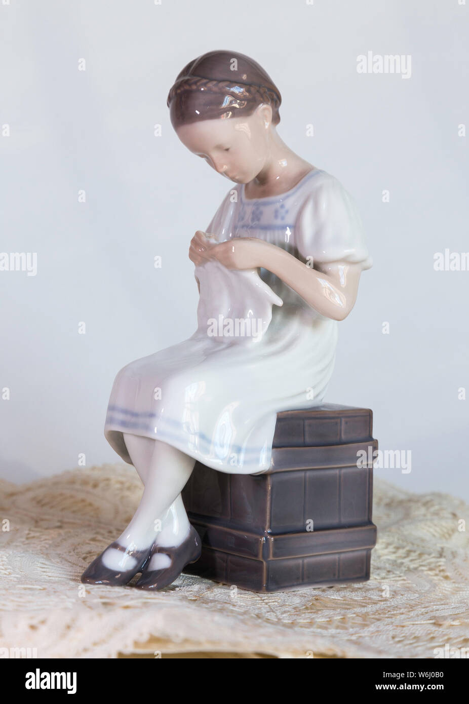 Vintage Royal Copenhagen Figurine Of Seated Girl Knitting Stock Photo Alamy