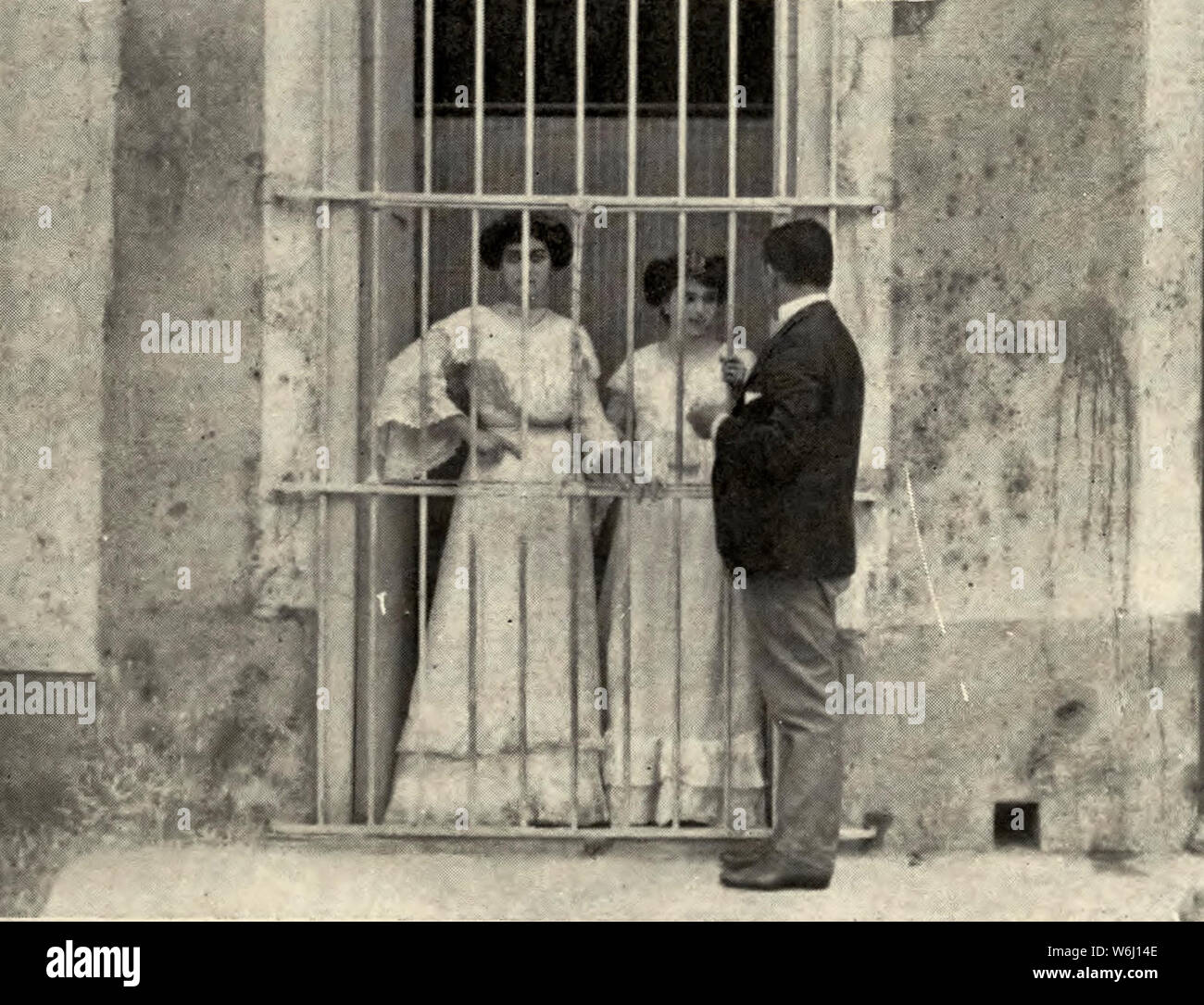 Window Courtship in Havana, Cuba, circa 1910 Stock Photo