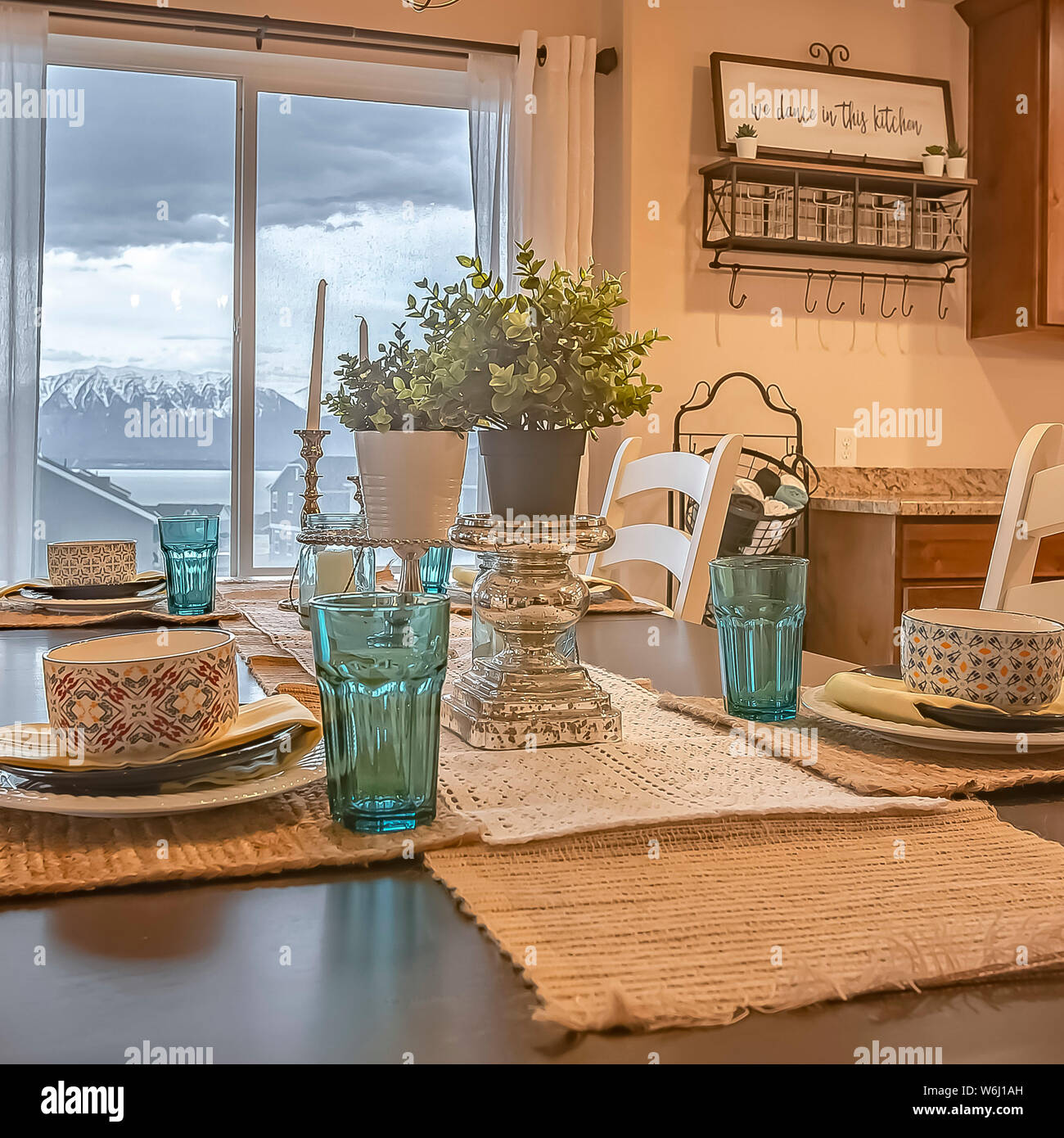 Square Dining Room With A View Through The Window Of Lake Snowy Mountain And Cloudy Sky Stock Photo Alamy
