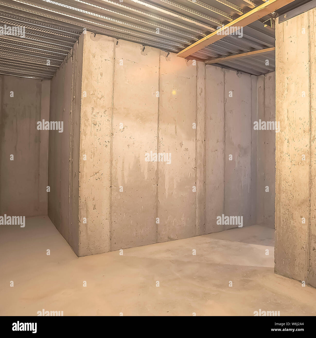 Square Interior Of An Empty Building With Concrete Wall And