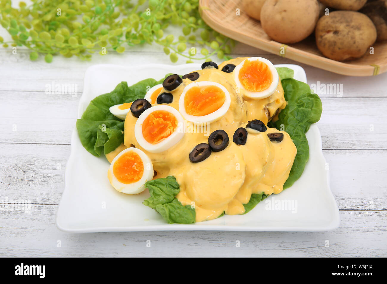 Potato with cheese sauce Stock Photo - Alamy