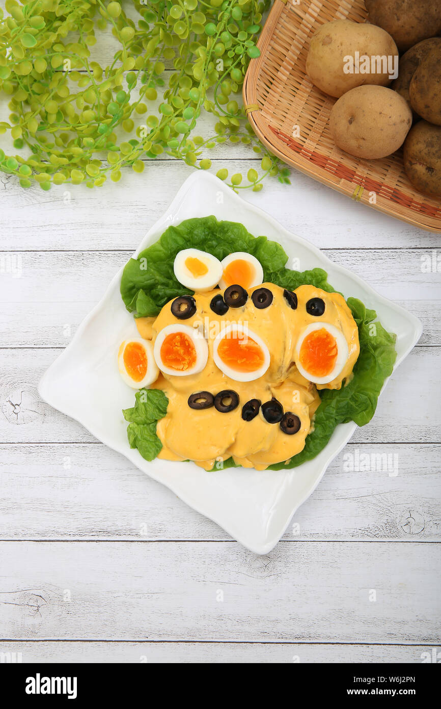 Potato with cheese sauce Stock Photo - Alamy