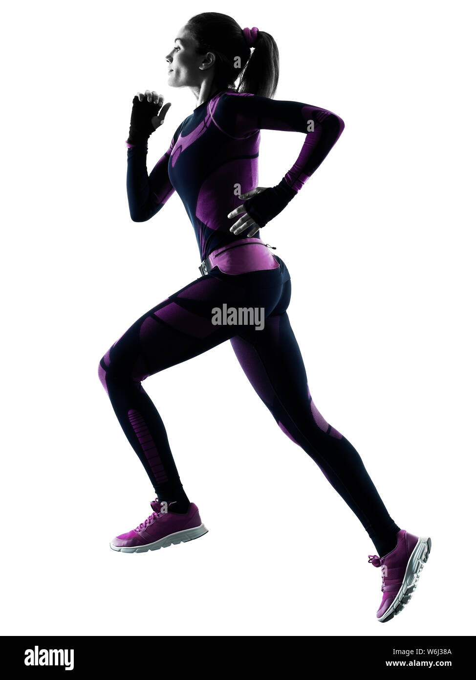 one young caucasian woman runner running jogger jogging isolated silhouette shadow on white background Stock Photo