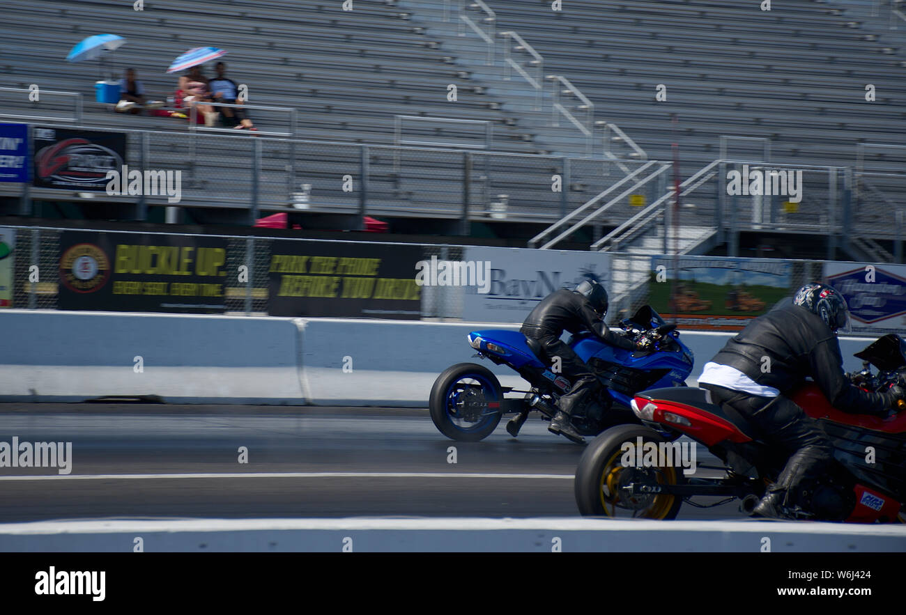 Two motorcycles during drag race at Maryland National Raceway Stock ...