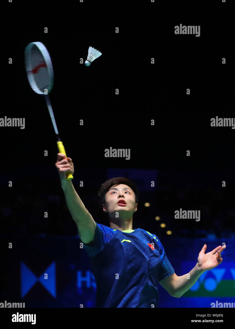 Shi Yuqi of China returns a shot to Lin Dan of China in the final match of the men's singles during the YONEX All England Open Badminton Championships Stock Photo