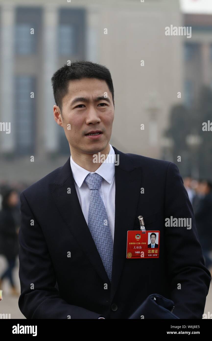 Retired Chinese table tennis player Wang Liqin arrives at the Great Hall of the People to attend the opening session for the First Session of the 13th Stock Photo