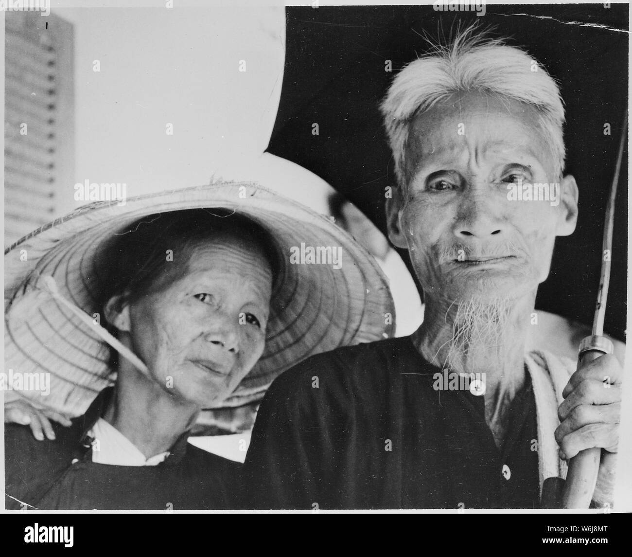 Le My, Vietnam....The wages of many years of war are reflected in the faces of this aged Vietnamese couple who live here in a United States Marine Corps-sponsored refugee camp here. During the past several months, hundreds of such Vietnamese families have been evacuated from Viet Cong terrorism to the center by Leathernecks of the 2nd Battalion, 3rd Marines Regiment, 3rd Marine Division. Stock Photo