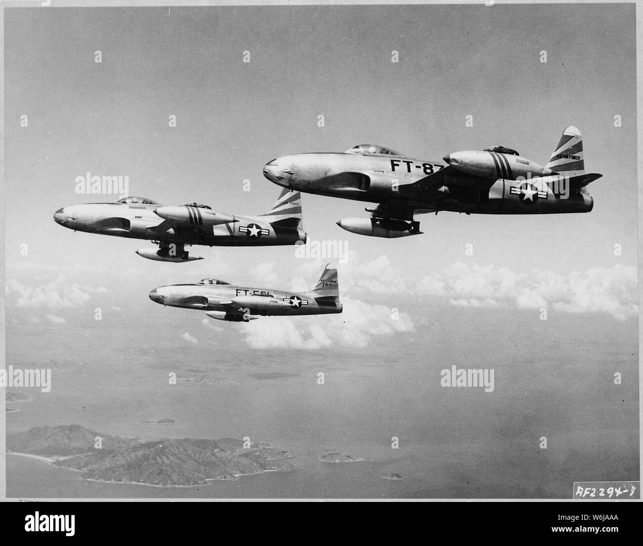 Loaded with 500-pound high explosive bombs under their wings, these U.S. Air Force F-80 Shooting Stars are shown flying toward Communist frontline positions from a forward air base in Korea; Scope and content:  Loaded with 500-pound high explosive bombs under their wings, these U.S. Air Force F-80 Shooting Stars are shown flying toward Communist frontline positions from a forward air base in Korea. These jet warcraft provided close air support for UN ground forces who were engaged in bitter fighting last week in the Bunker hill area. F-80s, of the Eighth Fighter Bomber Wing in Korea, provide c Stock Photo