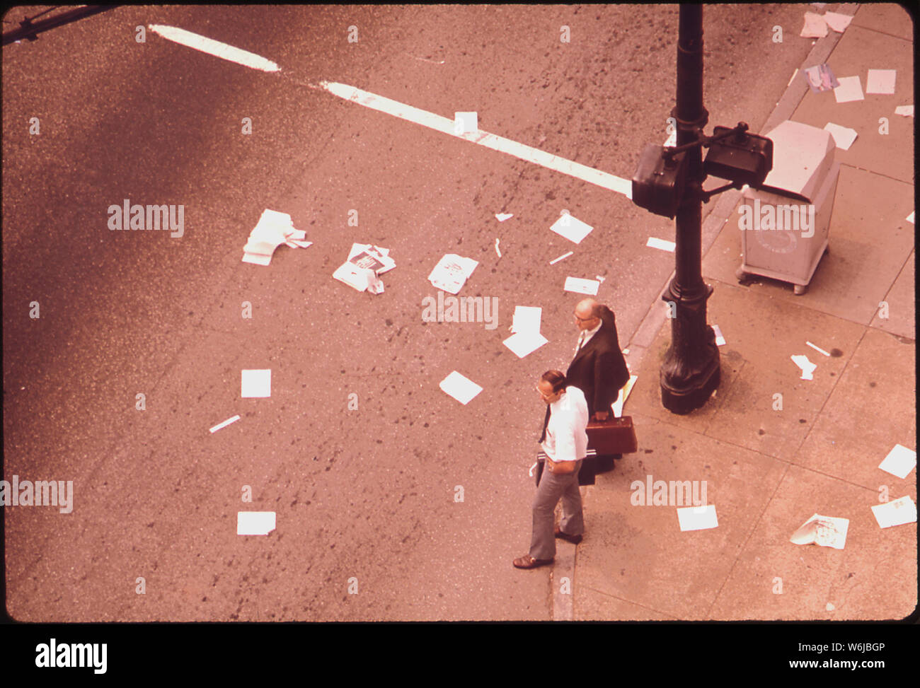 MAGAZINES AND NEWSPAPERS LITTER THE INTERSECTION OF SIXTH & BROADWAY
