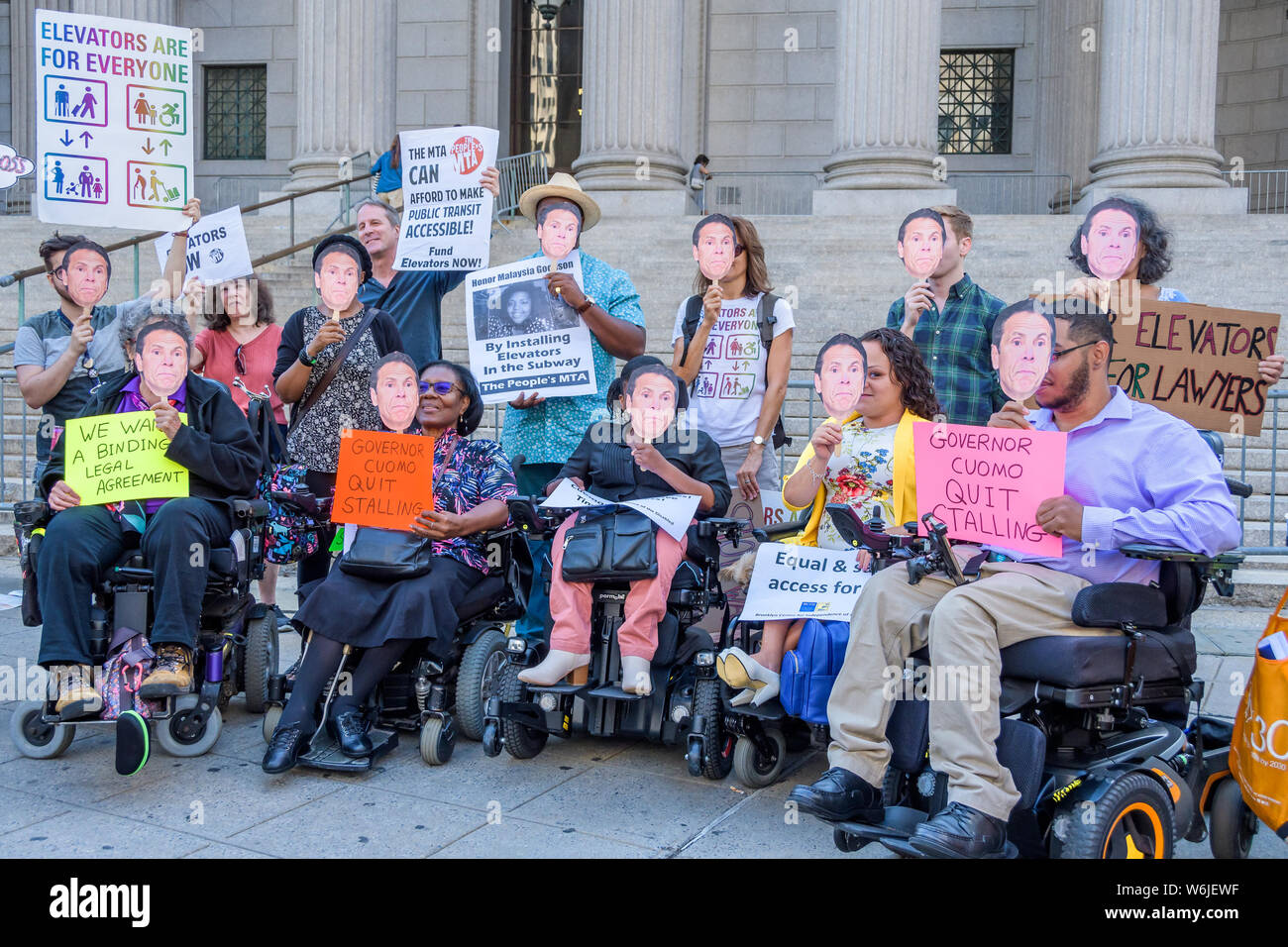 New York, United States. 01st Aug, 2019. Disability, transit and other activists held a rally outside the 60 Centre Street courthouse on Thursday, August 1, 2019 calling on Gov. Cuomo, who controls the MTA, to make a legally binding commitment for full subway accessibility. Credit: Erik McGregor/Pacific Press/Alamy Live News Stock Photo