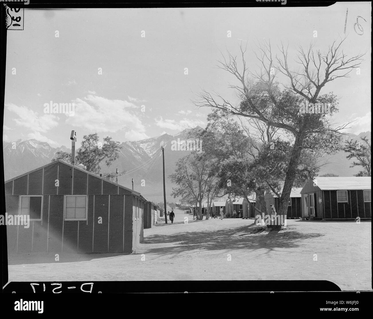 Manzanar Relocation Center, Manzanar, California. View of quarters at Manzanar, a War Relocation Au . . .; Scope and content:  The full caption for this photograph reads: Manzanar Relocation Center, Manzanar, California. View of quarters at Manzanar, a War Relocation Authority center where evacuees of Japanese ancestry will spend the duration. Mount Whitney, highest peak in the Untied States, in the background. Stock Photo