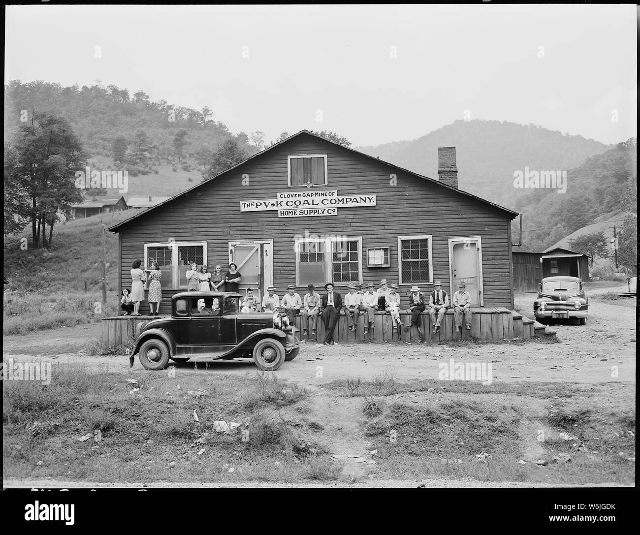 Miners and their families gather around the community store and office. P V & K Coal Company, Clover Gap Mine, Lejunior, Harlan County, Kentucky. Stock Photo