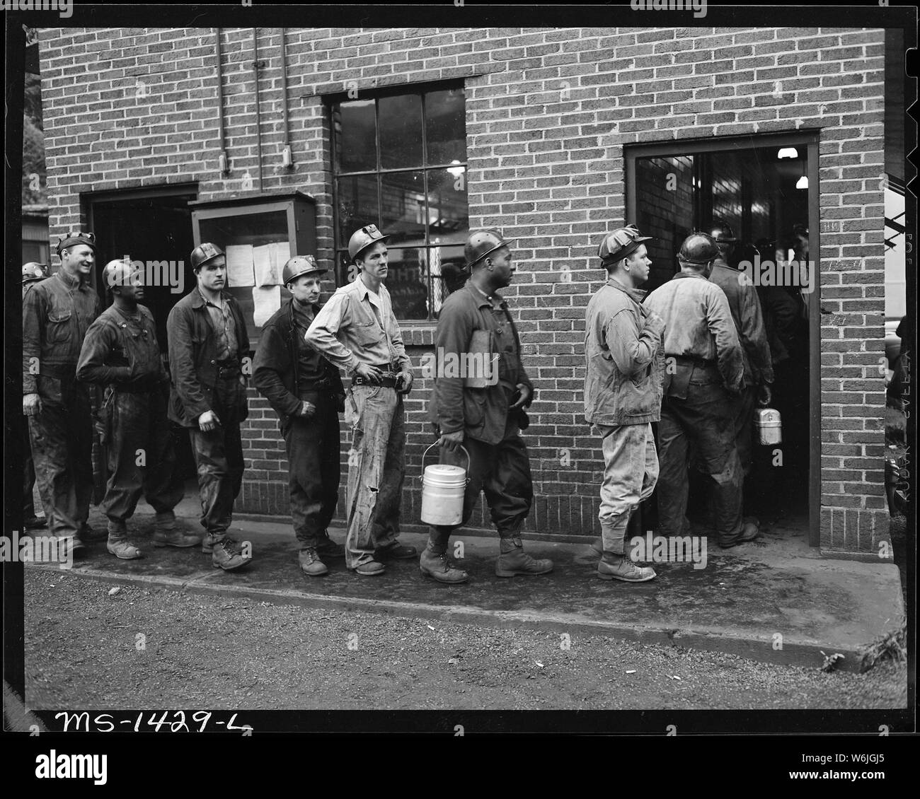 Miners going into lamp house to get their safety lamps. U.S. Coal and Coke Company, Gary Mines
