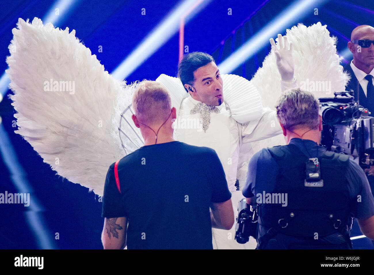 Cologne, Germany. 01st Aug, 2019. The comedian Bülent Ceylan (M) is on  stage as "Angel" at the ProSieben show "The Masked Singer". Credit: Marcel  Kusch/dpa/Alamy Live News Stock Photo - Alamy