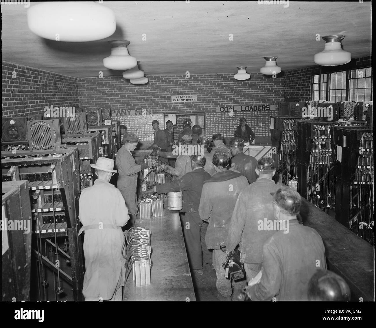 Miners checking in their safety lamps in the lamp house. The Pocahontas Corporation, Mines 33-34, Bishop, Tazewell County, Virginia. Stock Photo