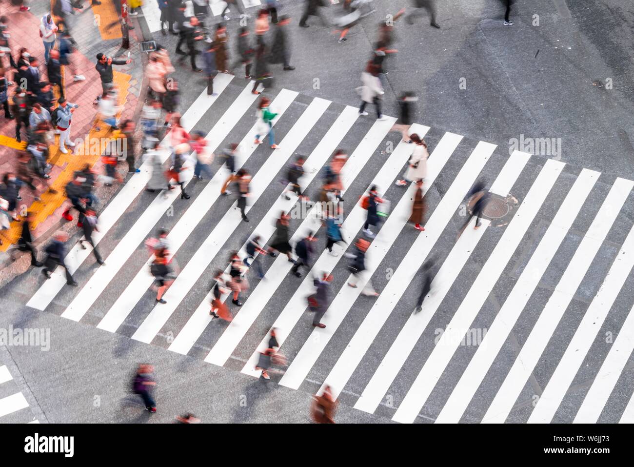 Shibuya crossing, crowds at intersection, many pedestrians cross zebra crossing, blurred motion, Shibuya, Udagawacho, Tokyo, Japan Stock Photo