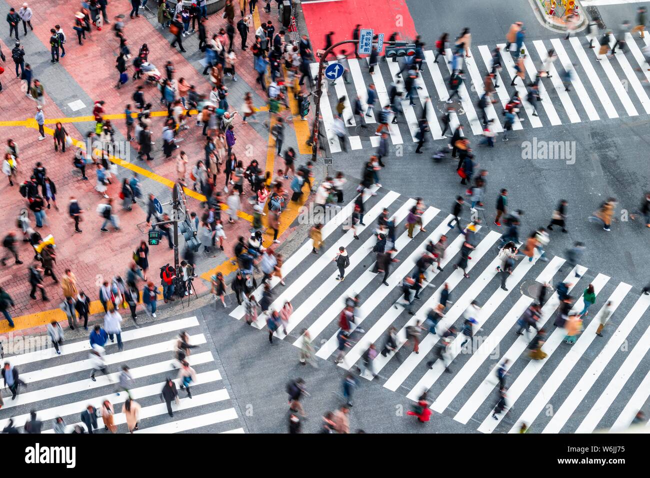 Shibuya crossing, crowds at intersection, many pedestrians cross zebra crossing, blurred, motion, Shibuya, Udagawacho, Tokyo, Japan Stock Photo
