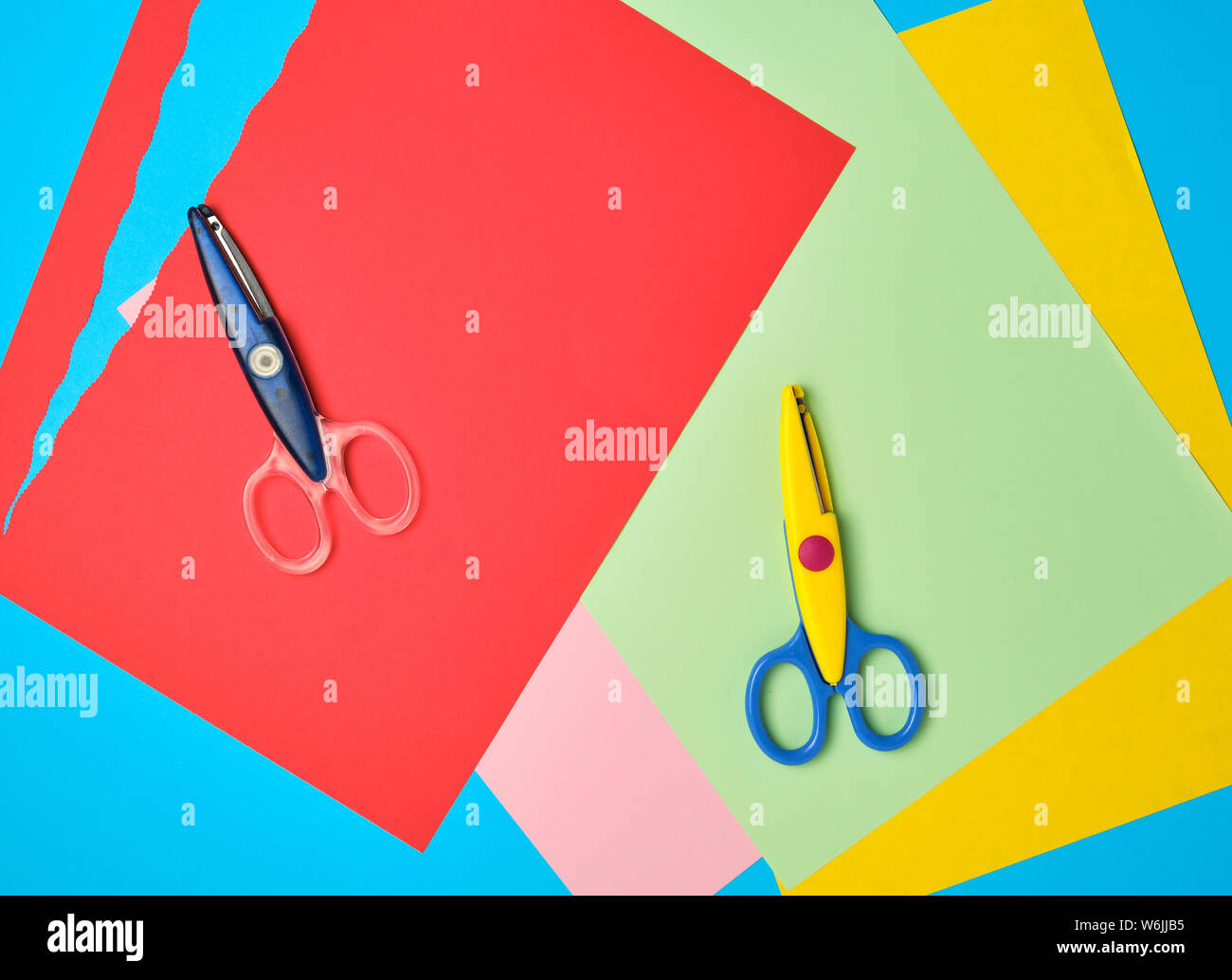Top view of colored paper with colorful scissors. Kids art and craft paper  applique background Stock Photo - Alamy