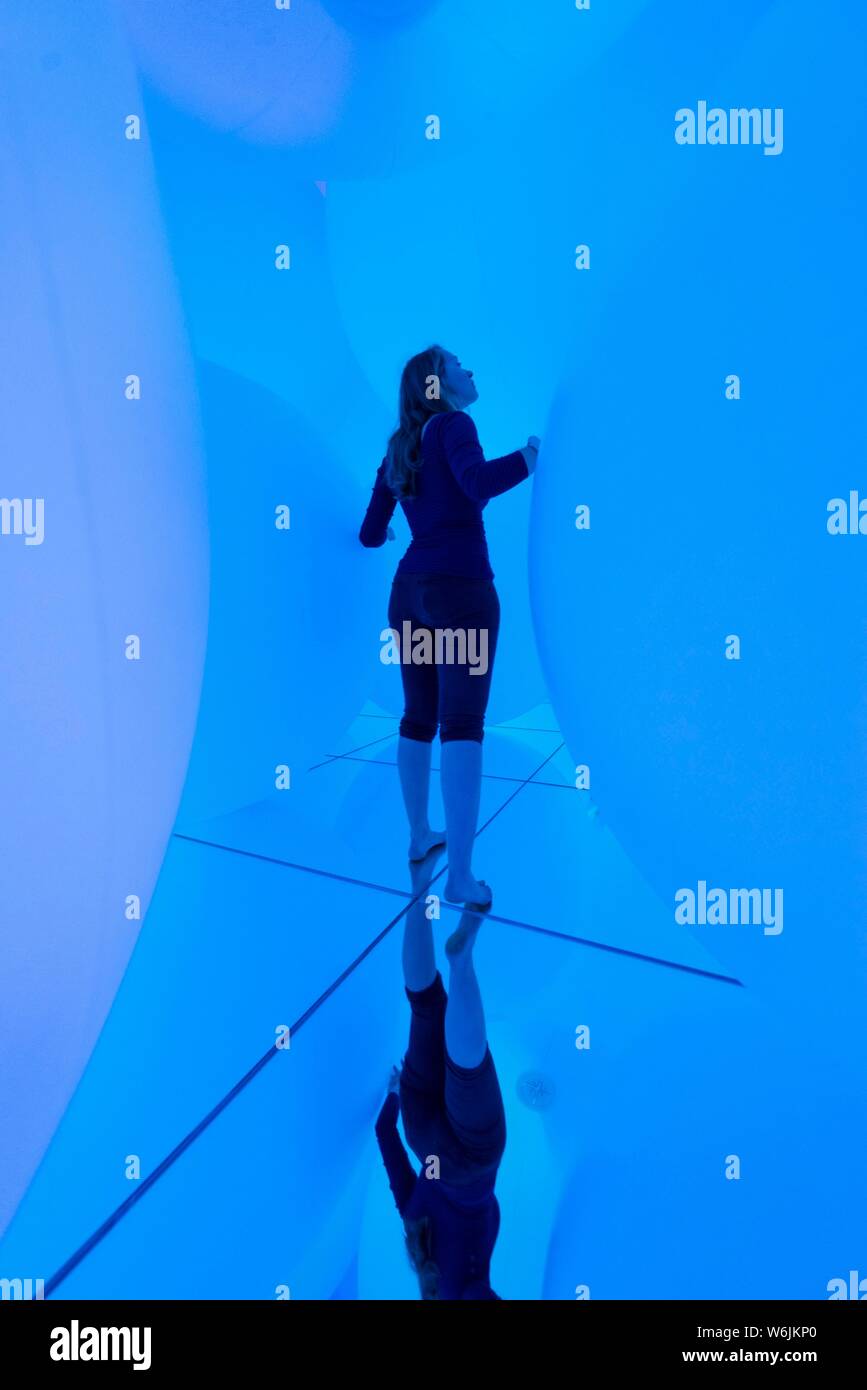 Young woman, Large illuminated spheres, LED installation in the Digital Art Museum, TeamLab Planets, Koto City, Tokyo, Japan Stock Photo