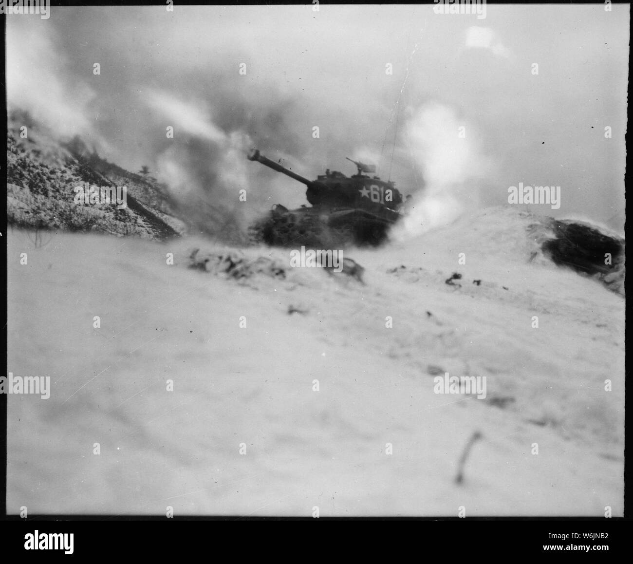 Near Song Sil-li, Korea, a tank of 6th Tank Battalion, fires on enemy positions in support of the 19th Regimental Combat Team.; General notes:  Use War and Conflict Number 1438 when ordering a reproduction or requesting information about this image. Stock Photo