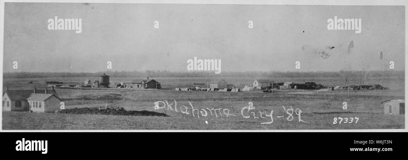 Oklahoma City, Indian. Terr., in 1889 showing U.S. Government dwellings, water tank, railroad station, hotel, post office and store, stage stables, tents of 13th Infantry detachment guarding lumber and an uncompleted cemetery Stock Photo