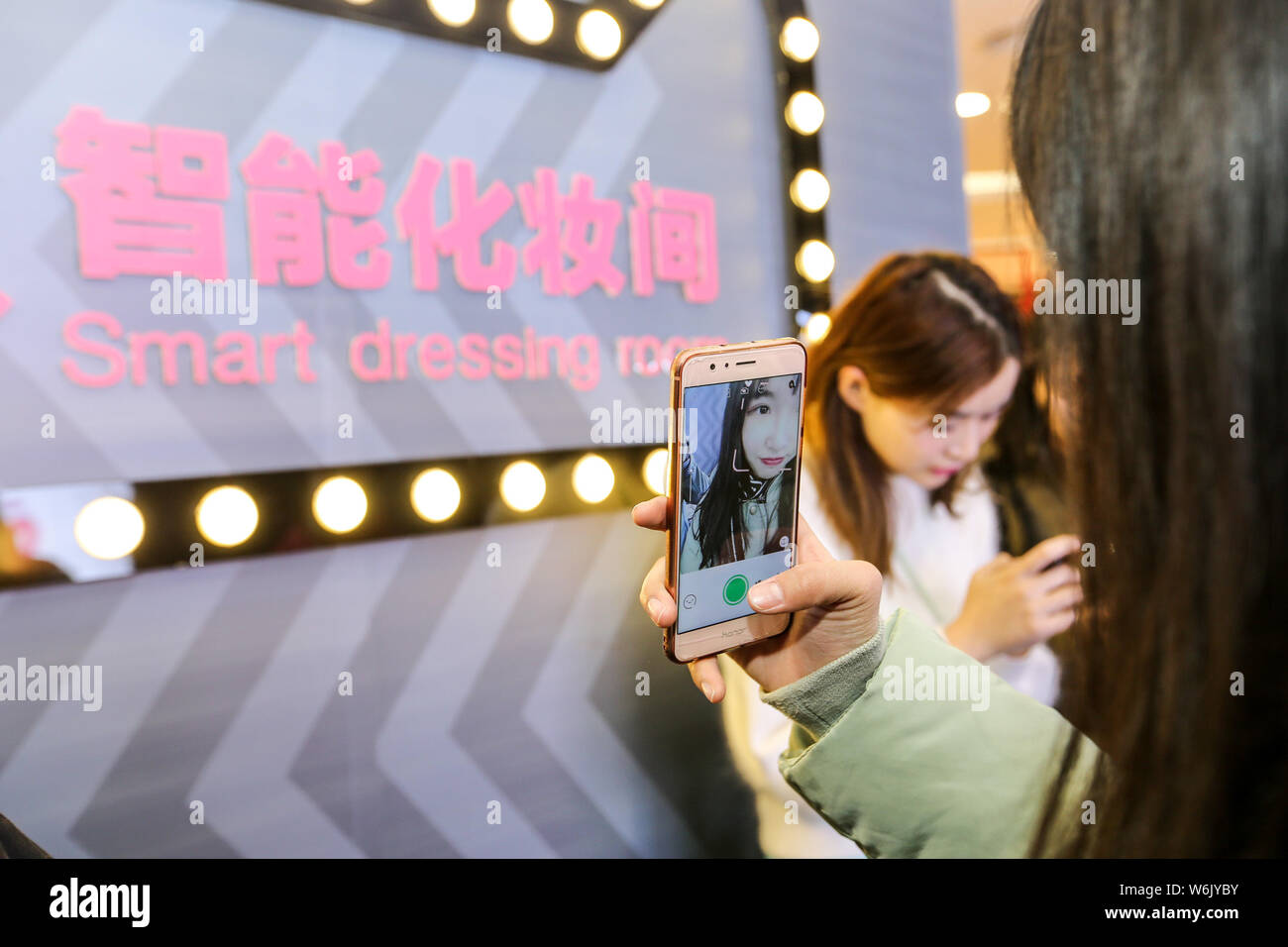 A Female Customer Takes Selfies At The World S First Smart