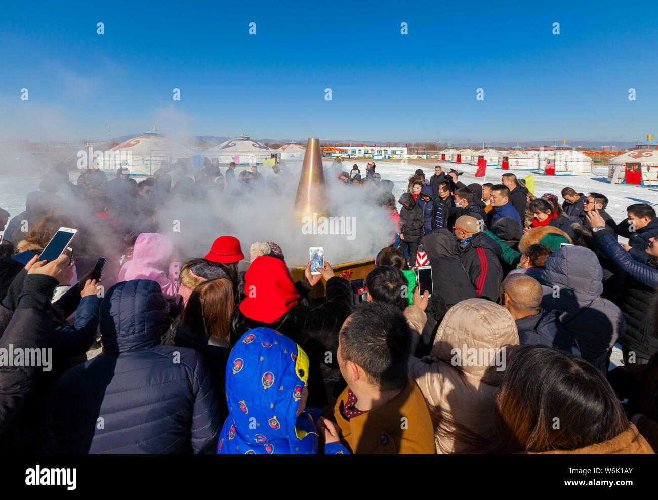 Tourists enjoy a giant hot pot during the first Ice and Snow Hotpot