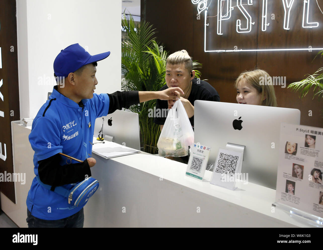 FILEA handicapped food delivery courier of Chinese meal delivery company Ele.me delivers