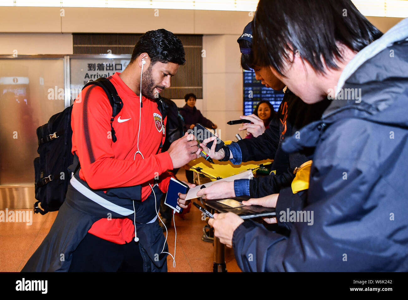 Brazilian soccer player Givanildo Vieira de Sousa, better known as Hulk, of Shanghai SIPG F.C. signs autographs for Japanese fans upon arrival at the Stock Photo
