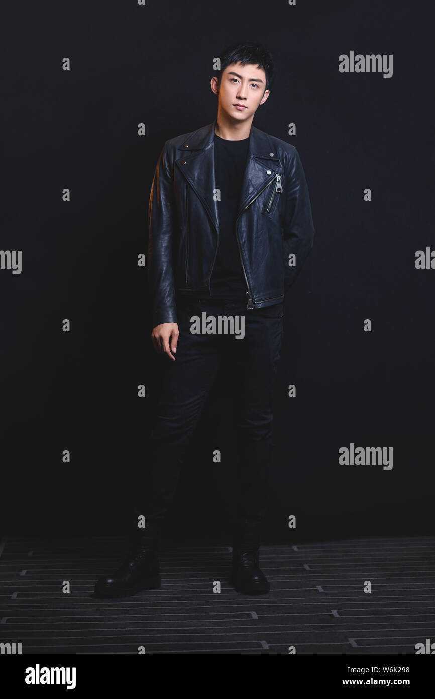 Chinese actor and model Huang Jingyu, also known as Johnny Huang, poses for portrait photos during an exclusive interview by Imaginechina in Beijing, Stock Photo