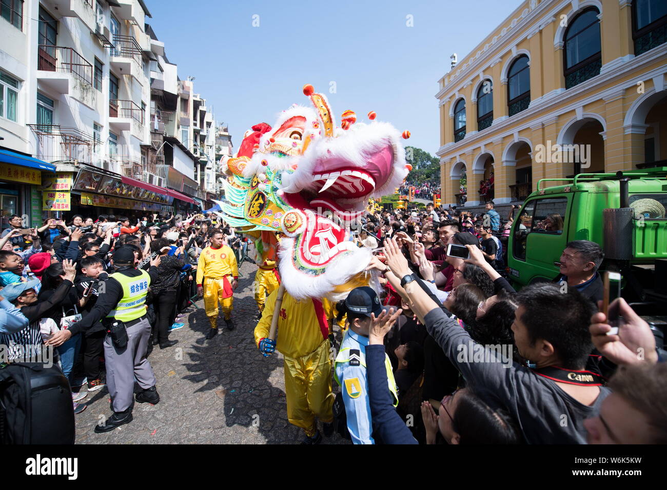 Tourists watch dragon and lion dance performance to celebrate the ...