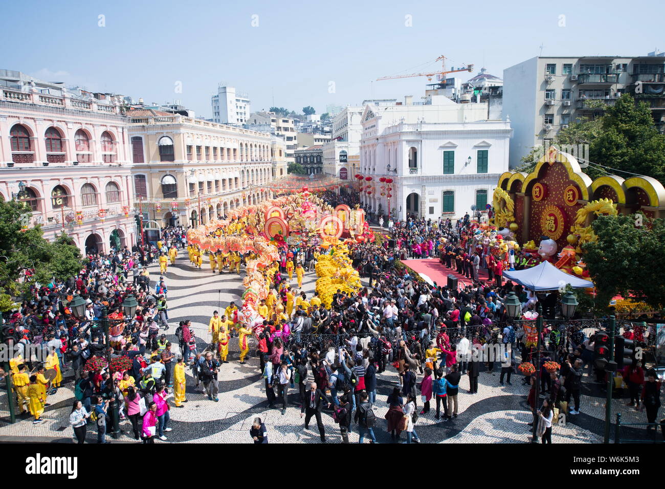 Tourists watch dragon and lion dance performance to celebrate the ...