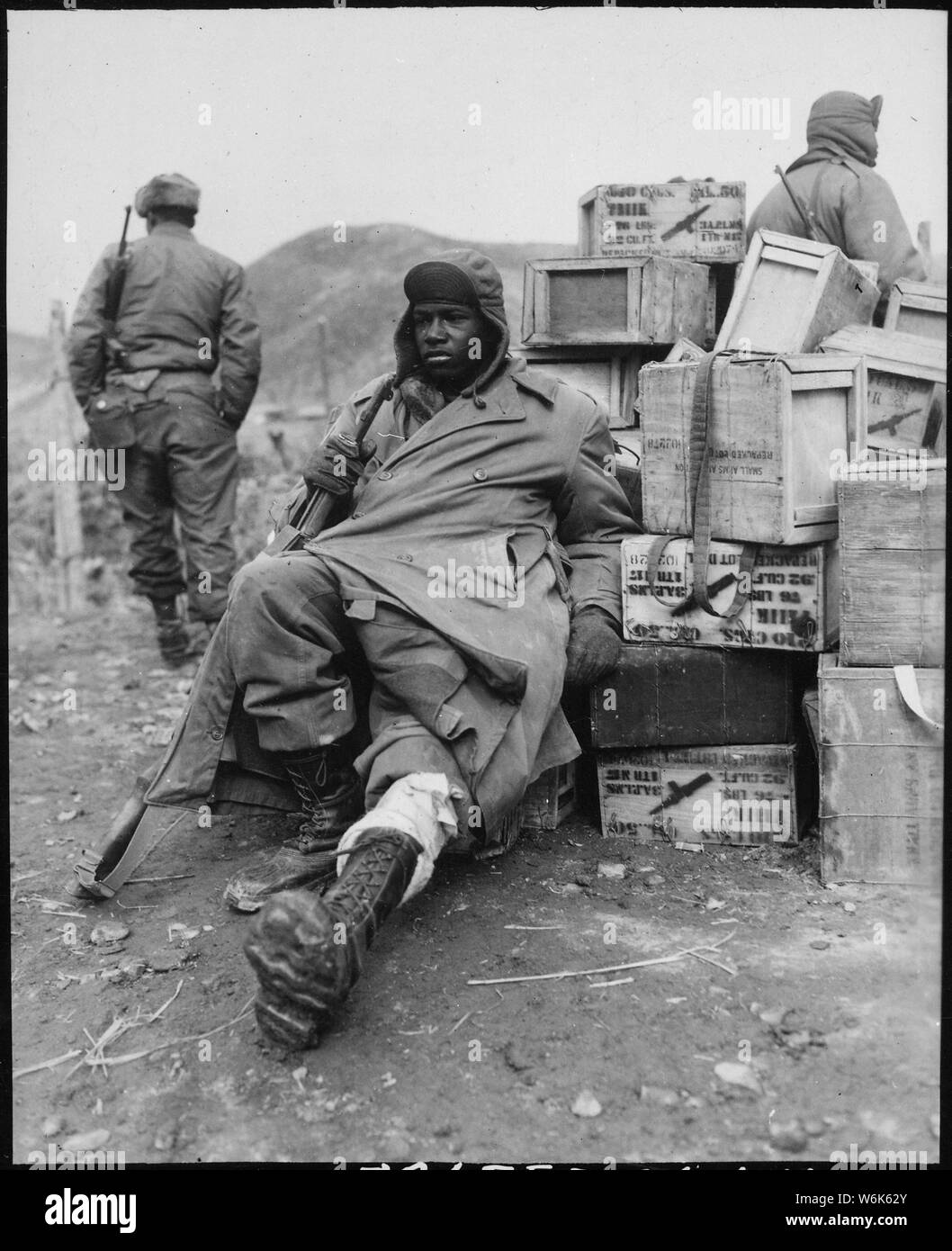 Private First Class Edward Wilson, 24th Infantry Regiment, wounded in leg while engaged in action against the enemy forces near the front lines in Korea, waits to be evacuated to aid station behind the lines.; General notes:  Use War and Conflict Number 1394 when ordering a reproduction or requesting information about this image. Stock Photo